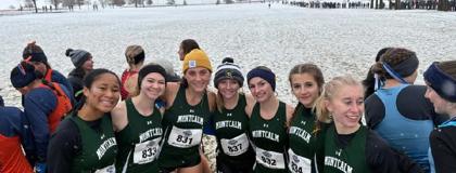 MCC's women's cross country team pictured outside with snow on the ground behind them as they prepare for the NJCAA Division II National Championship meet. 