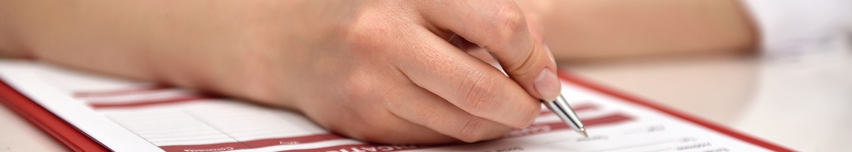 Medical office assistant filling out charts