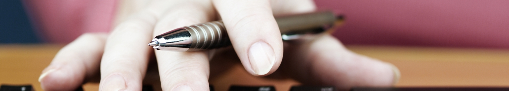 Person typing on computer keyboard