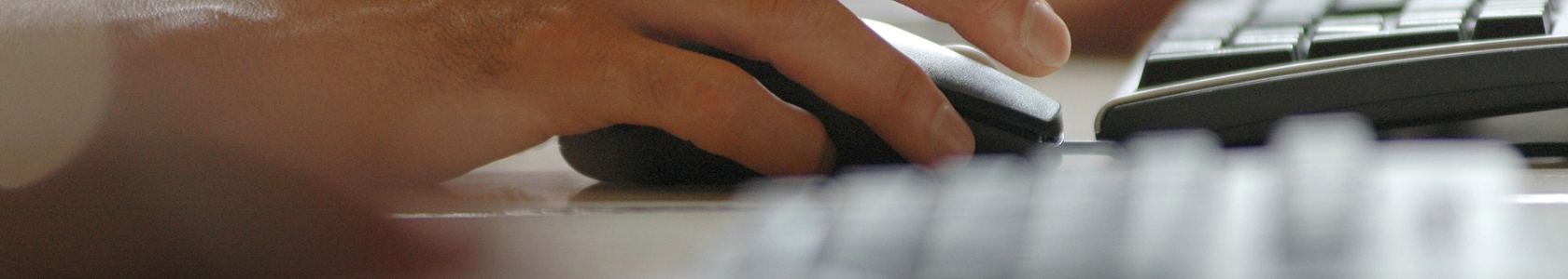 Person typing on computer keyboard