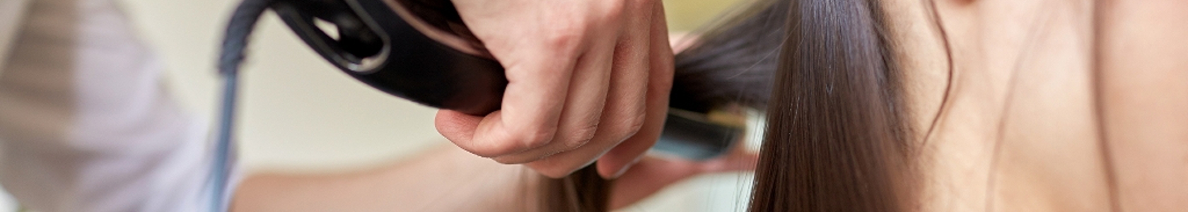 Hair stylist straightening hair