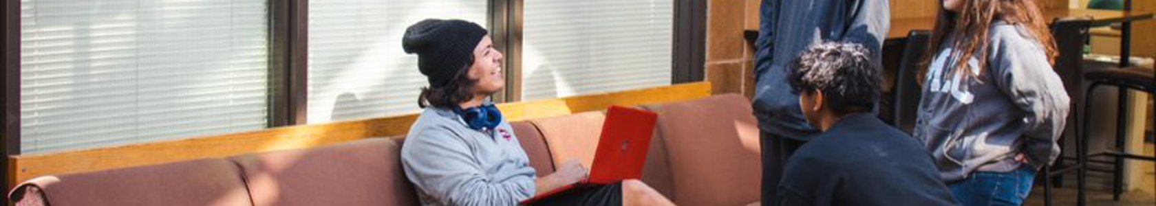 students sitting in cyber cafe.