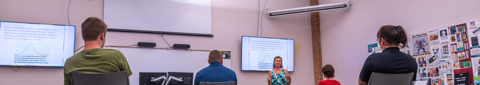instructor in front of a classroom