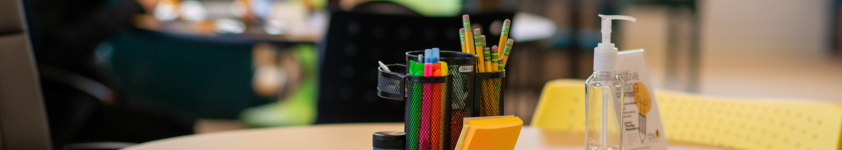 table with writing supplies on it