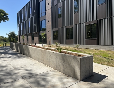 Exterior of the Student Housing building featuring the landscaping box on the backside of the building.