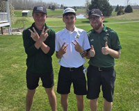 Ethan Johnson, Zach Johnson and Mason Blair (MCC Golfers) standing on golf course.