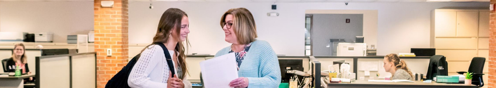 Photo of student getting help from student services