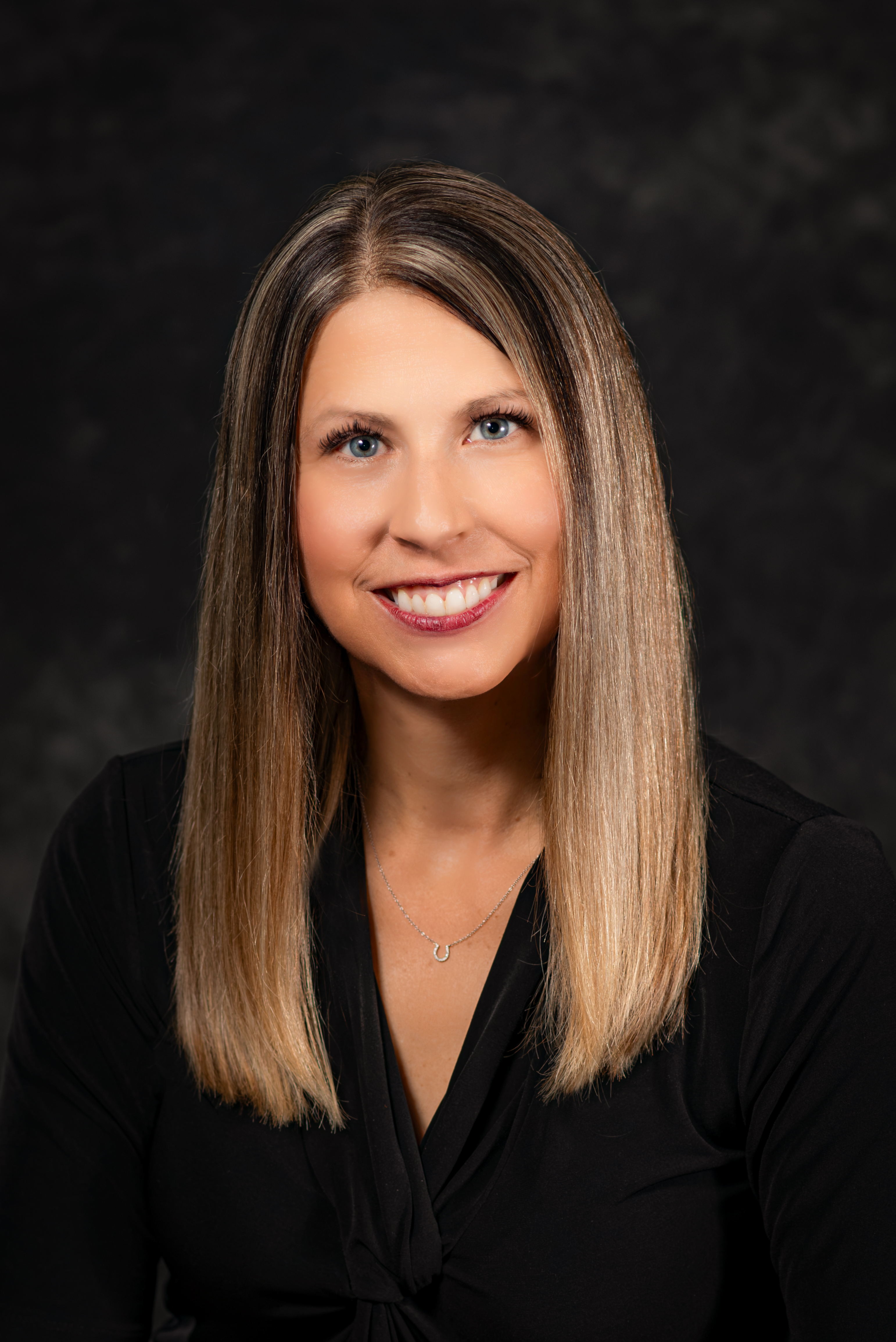 Headshot of Brandy Bunting wearing a black shirt.
