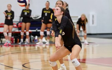 MCC volleyball player bumping the ball during a match.