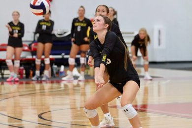 MCC volleyball player bumping the ball during a match.