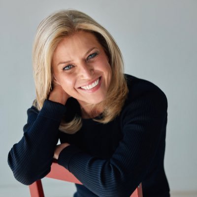 Author Susan Hendricks headshot wearing a black shirt with blonde hari and blue eyes.