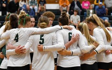 MCC volleyball team huddled
