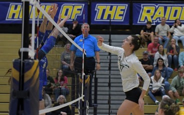 MCC volleyball player jumping for a spike