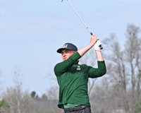 MCC golfer on the course hitting the ball.