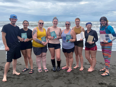 Group photo of students and staff on the beach in Costa Rica on a study abroad trip in Spring 2026.