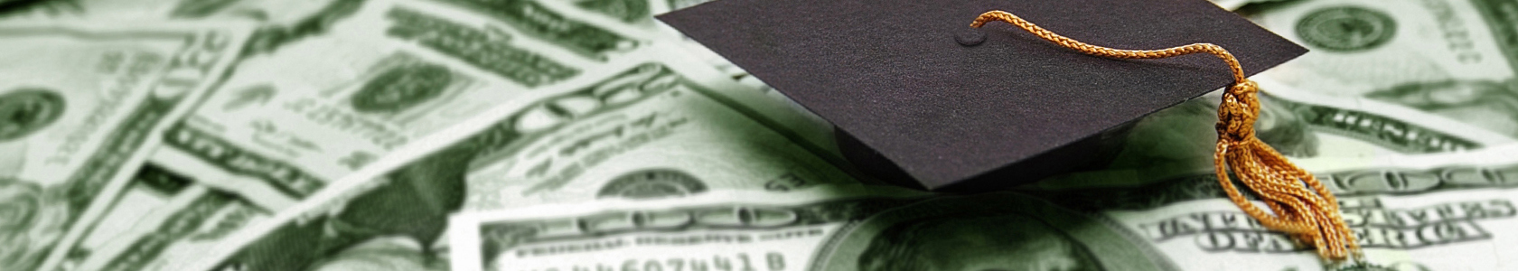 A Graduation Cap on top of a bed of dollar bills