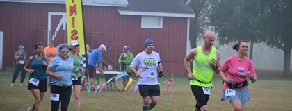 Runners at the 2024 Bramble Ramble race leaving the start line.