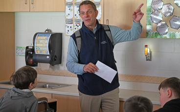 Educators Cooperative CEO Steve Regur gives a brief classroom lesson to Hailey Doornbos’ fourth-grade class at Central Montcalm Upper Elementary during a recent visit. 