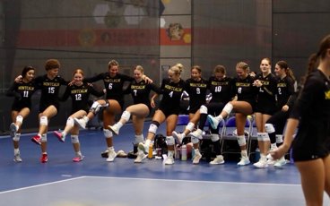 MCC Women's Volleyball team having fun on the court before a match.